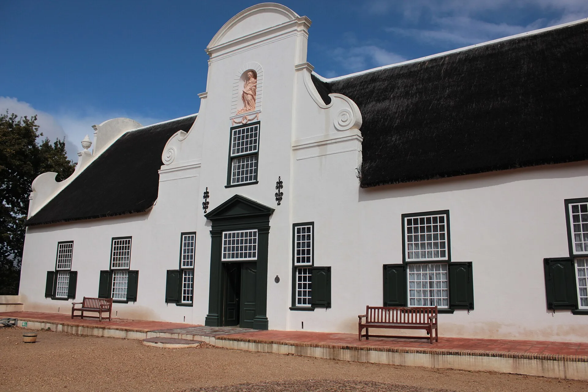 A whitewashed Cape Dutch manor house in the Cape Winelands, South Africa