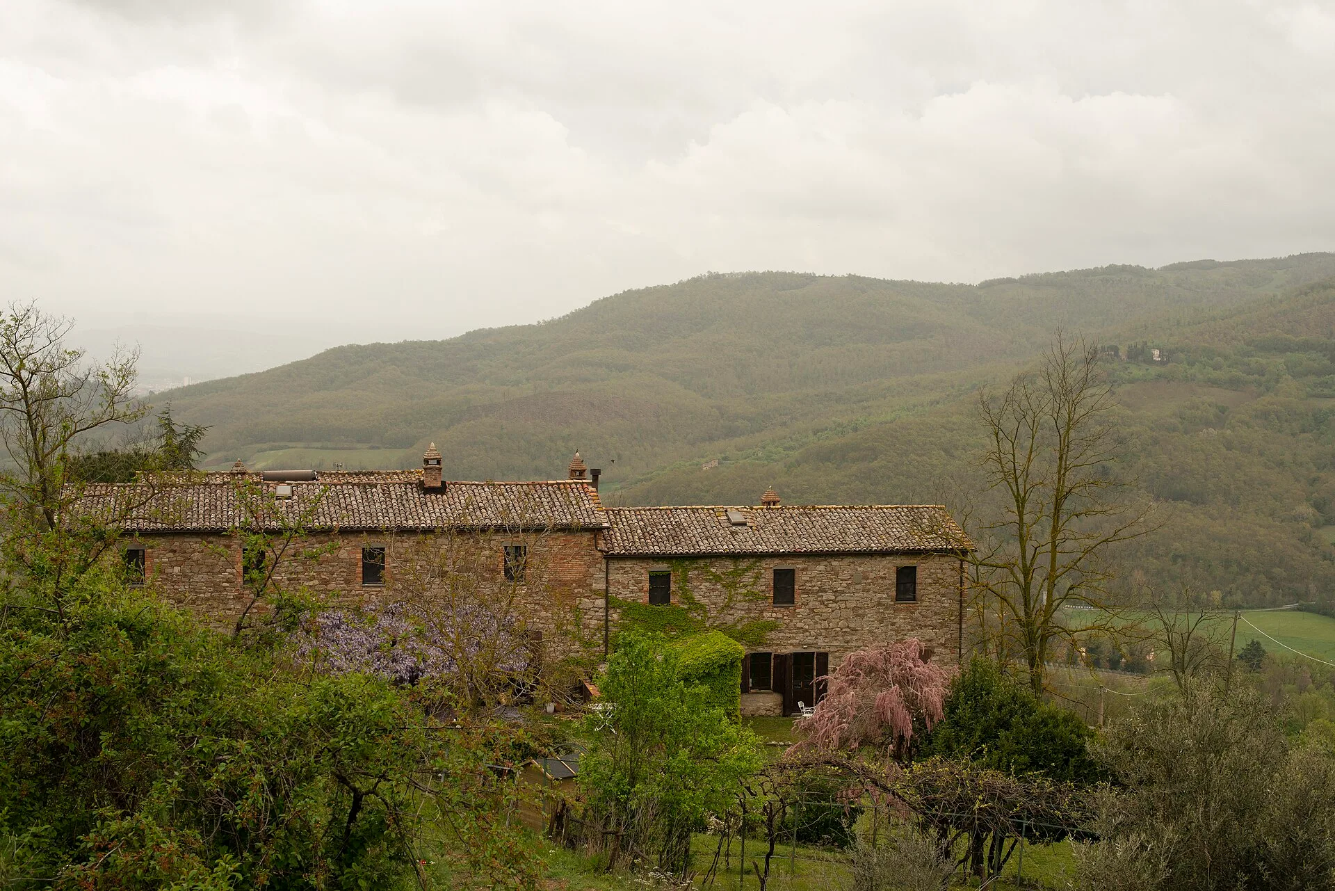 A stone farmhouse in the rolling countryside of Umbria, Italy