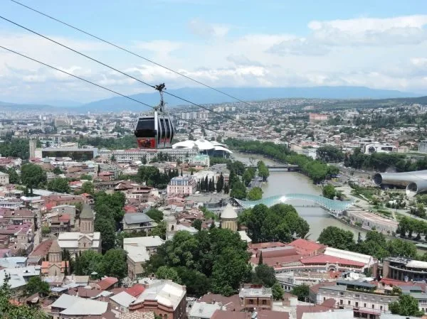 Aerial view of Tbilisi's old town with the red cable car and the Bridge of Peace