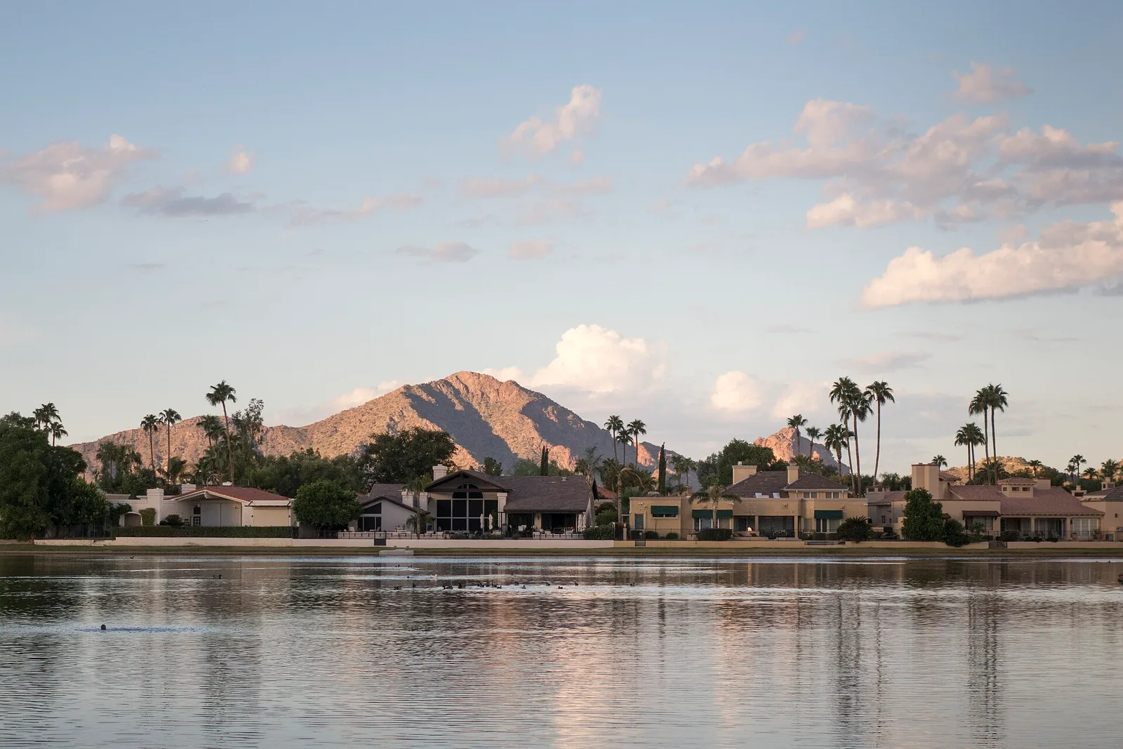 Desert mountains reflected in a still lake at golden hour near Scottsdale, Arizona