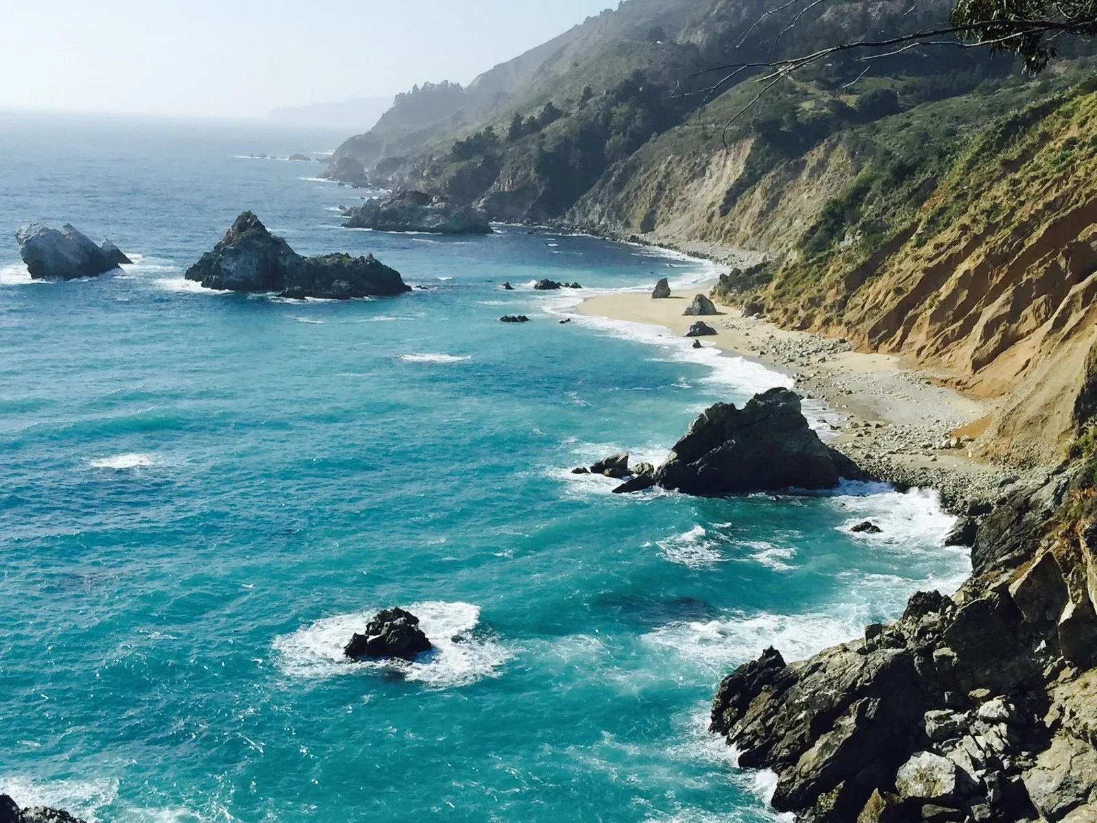 Turquoise coves, rocky sea stacks and forested cliffs meeting the Pacific along the Big Sur coast in California