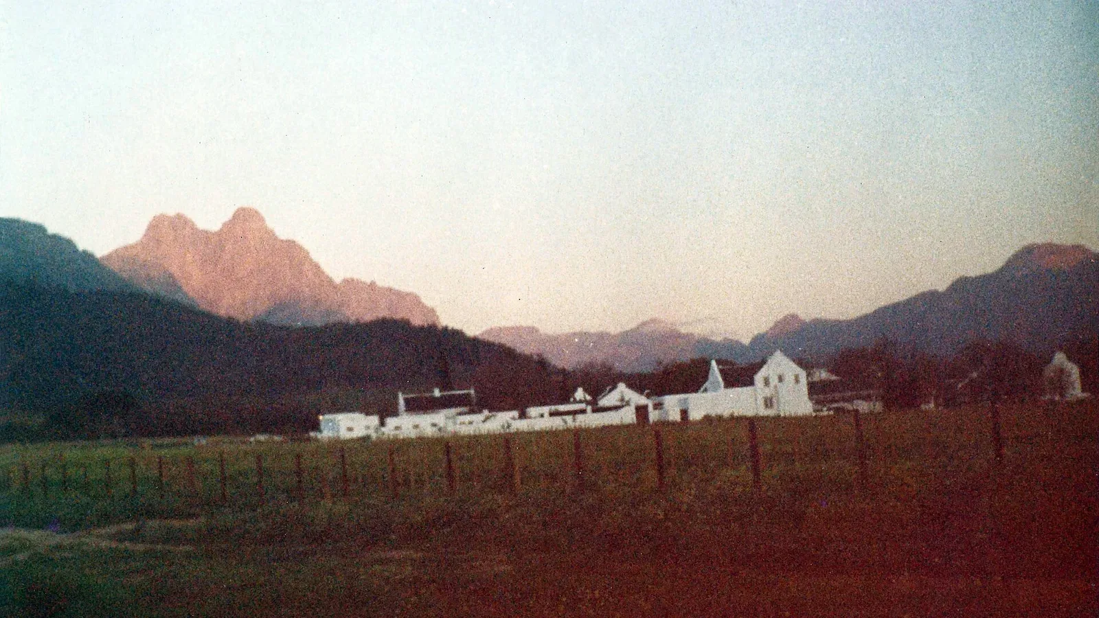 A Cape Dutch wine estate below the Jonkershoek mountains in the Stellenbosch winelands, South Africa