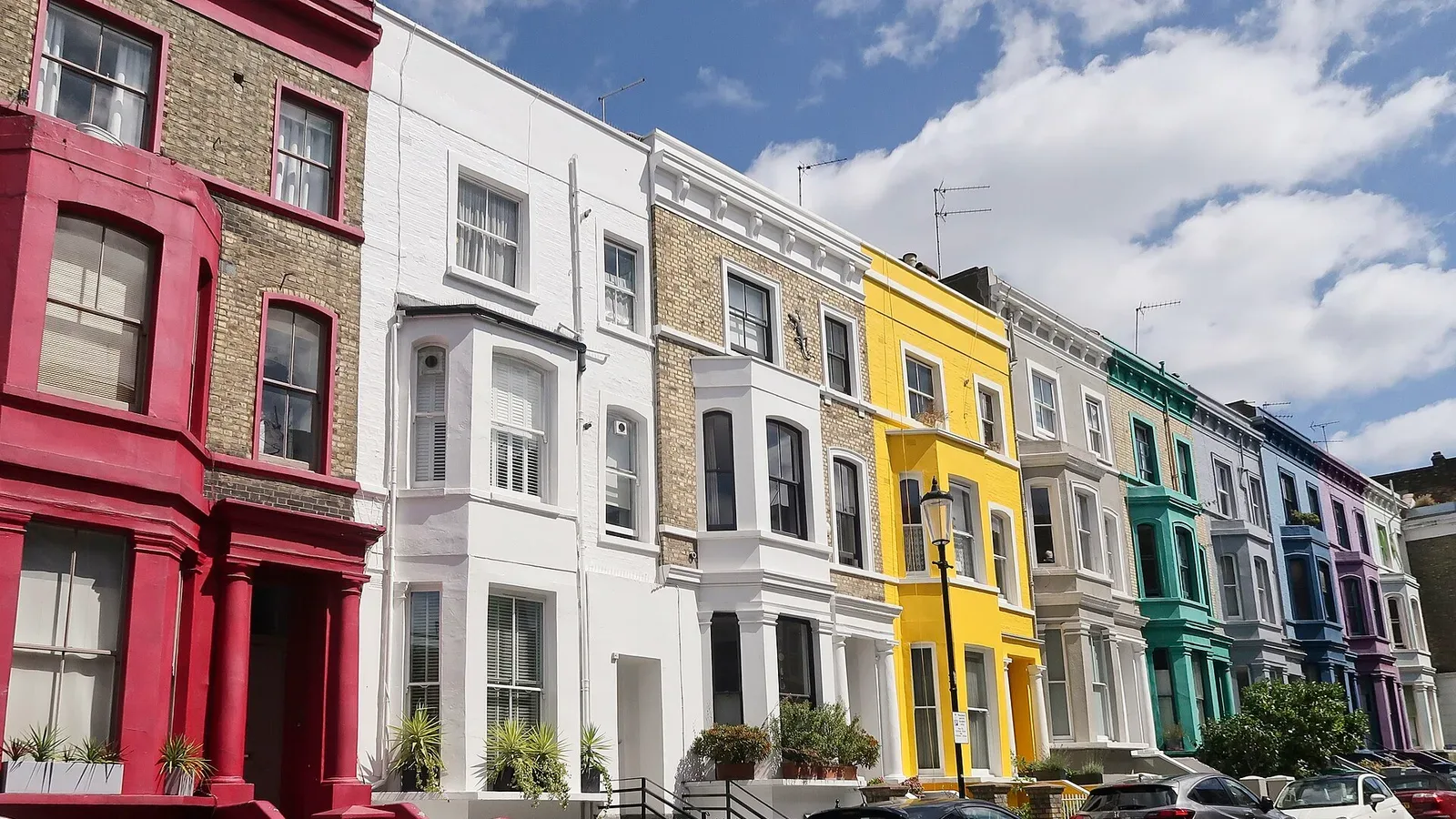 Colourful terraced houses on Lancaster Road in Notting Hill, a fashionable and walkable London neighbourhood for young professionals